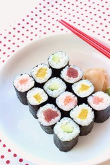 Hosomaki sushi  tuna, smoked salmon and vegetables inside