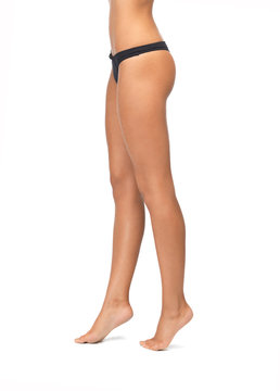 female legs in black bikini panties