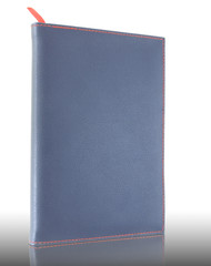 blue leather notebook on reflect floor and white background