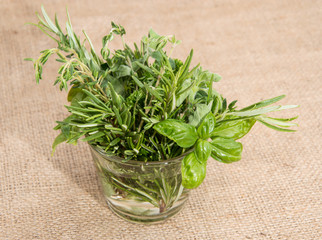 Glass filled with fresh Herbs