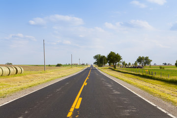 American Country Road With Cloudy Blue Sky