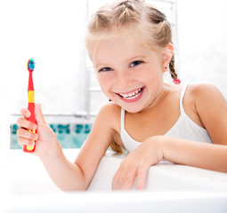 Little girl brushing teeth