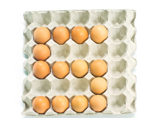 Number five made of  eggs  on white background.