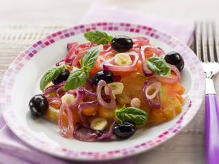 salad with ox heart tomatoes, onions olives and garlic