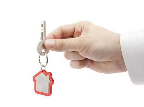 House key in hand with clipping path