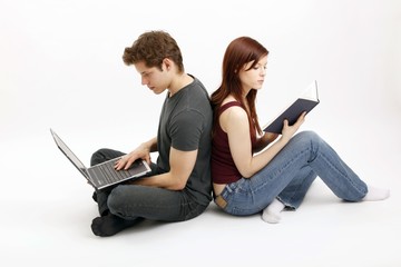 young couple with notebook and book