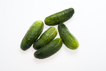 A fresh green cucumber isolated on a white background