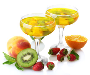 punch in glasses with fruits, isolated on white