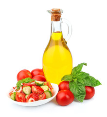 Bottle of oil with vegetables