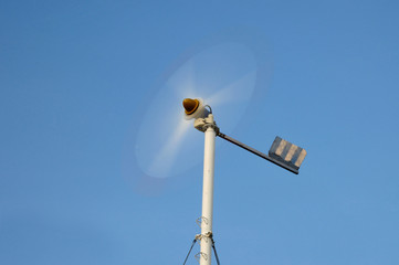 Spinning mini wind turbine on blue sky at Phuket, Thailand.