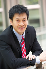 Portrait Of Chinese Businessman Outside Office