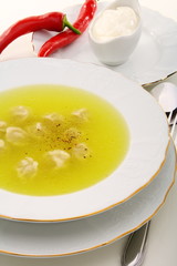 Dumplings with broth and red chilli.