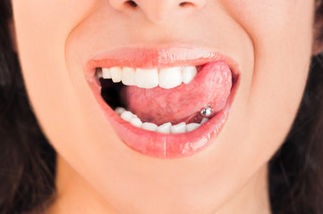 Pierced tongue licking lips - 43932823