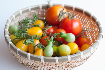 Bamboo basket full of tomatoes