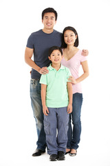 Full Length Studio Shot Of Chinese Family