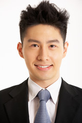 Studio Portrait Of Chinese Businessman