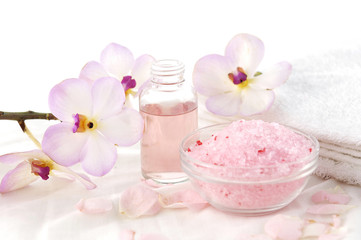 Spa setting –orchid, salt in bowl ,towel ,massage oil