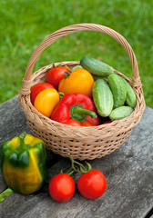 vegetables in a basket on wooden table