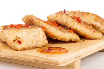 Fried fish fillets with  salad.