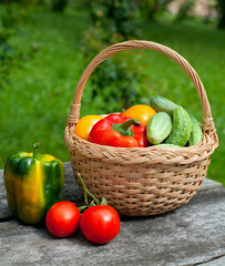 vegetables in a basket on wooden table