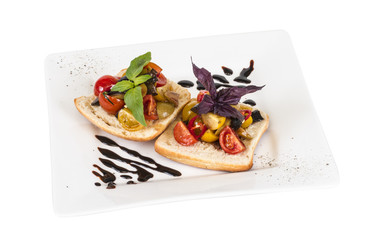 juicy tomatoes on fresh bread, pesto as topping