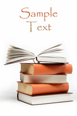 A stack of books on a white background.