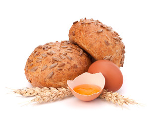 Bun with seeds and broken egg