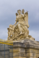 Fototapeta na wymiar Sculpture in Versailles Palace. Paris, France.