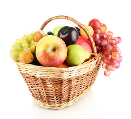 Still life of fruit in basket isolated on white