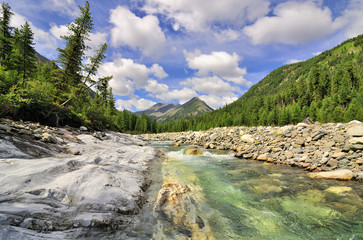 Mountain River and monolithic stone beach