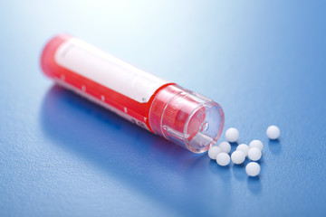 Modern homeopathic pills and container