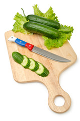 Tomatoes and cucumbers on white