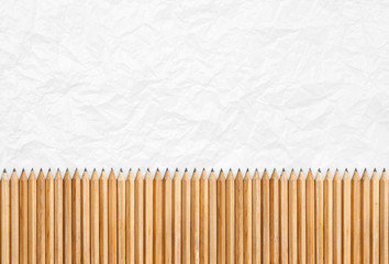 Pencils isolated, texture of paper as background