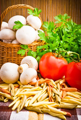 Wicker basket full of fresh champignon mushrooms