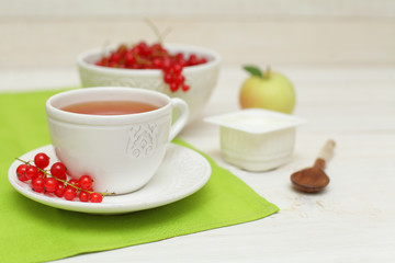 Tea and redcurrant, food background