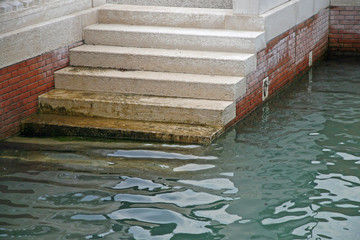 marble stairs that descend to the sea