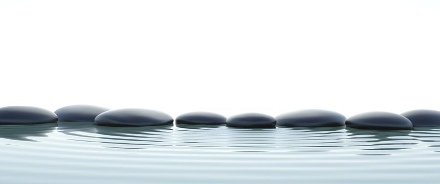 Zen stones in water on widescreen