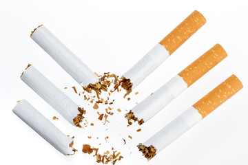 three broken cigarette on a white background