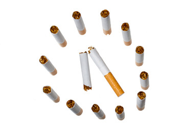 Broken cigarette isolated over the white background
