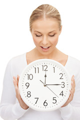 woman holding big clock