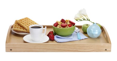 light breakfast on wooden tray isolated on white