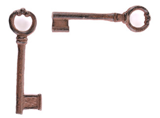 Two antique keys isolated on white