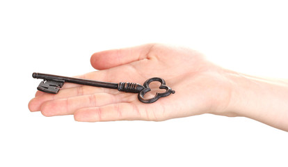 woman's hand holding an antique key on white background
