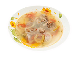 appetizing Soup with Chicken giblets in plate isolated