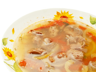 appetizing Soup with Chicken giblets in plate isolated on white