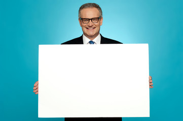 Business representative holding blank ad board