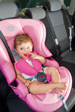 baby  in a safety car seat. Safety and security 