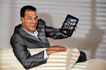 young man on the sofa with tablet-pc
