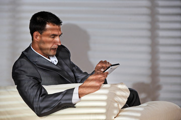 young man on the sofa with tablet-pc