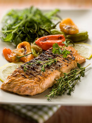 grilled salmon with capsicum and arugula, selective focus